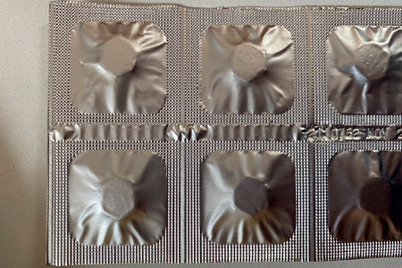 Pack view of a Misoprolen tablet, showcasing the back side, displaying distinctive markings and branding typical in Peru.